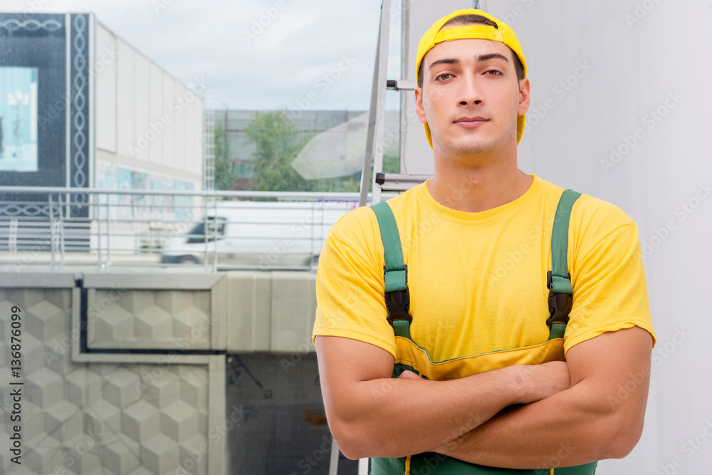 Repairman in coveralls in DIY concept Repairman in coveralls in DIY concept