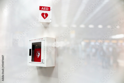 AED Automated External Defibrillator sign at an airport. double exposure photo