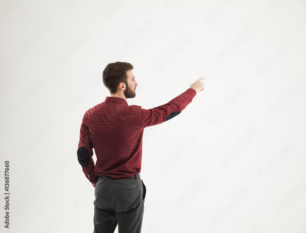 rear view - a successful Manager of a pointing hand on the blank