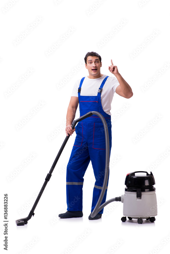 Man in coveralls doing vacuum cleaning on white Man in coveralls doing vacuum cleaning on white