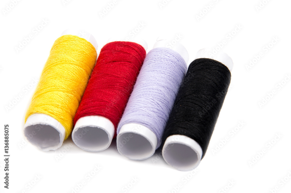 Colorful spools of thread isolated on white background Colorful spools of thread isolated on white background