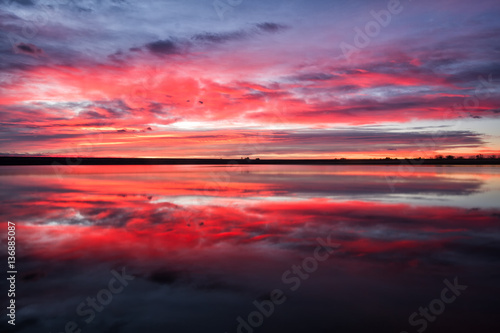 Colorful sunrise reflection on a lake
