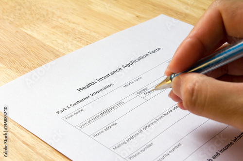Man fill the health insurance application form