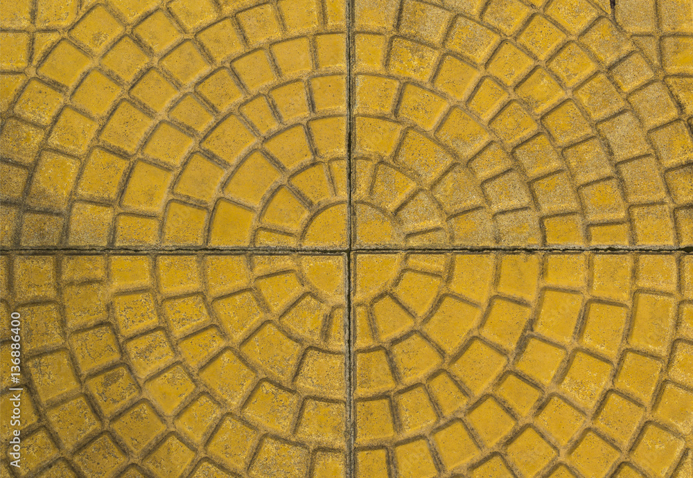 Circular yellow brick paving pattern