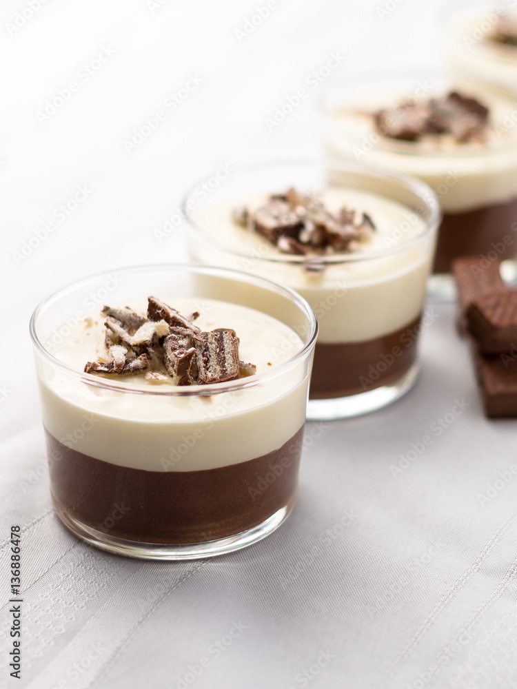 No-bake layered chocolate mousse and cheesecake with chocolate covered wafer cookie crumbs topping. In clear glass dessert bowls. On white background. Great recipe, creamy, light and not too sweet! No-bake layered chocolate mousse and cheesecake with chocolate covered wafer cookie crumbs topping. In clear glass dessert bowls. On white background. Great recipe, creamy, light and not too sweet!