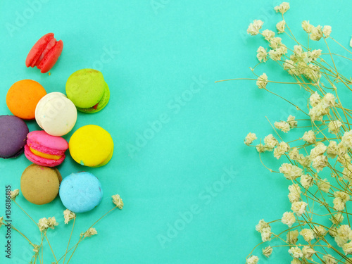 french macaroons with dryied flower and copy space background photo