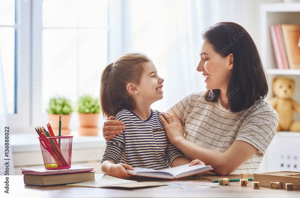 Mom and child reading a book Mom and child reading a book