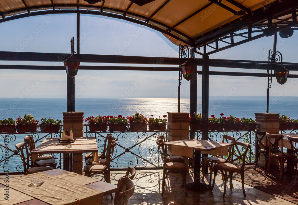 The interior of the restaurant overlooking the sea