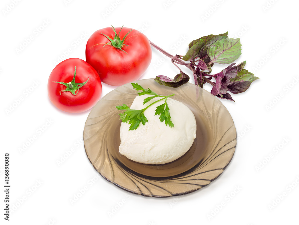Mozzarella cheese on glass saucer, tomatoes and potherb Mozzarella cheese on glass saucer, tomatoes and potherb