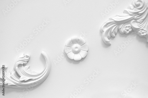 Stucco elements on white wall