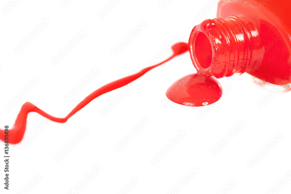 Red nail polish spilled. Isolated on white. Red nail polish spilled. Isolated on white.