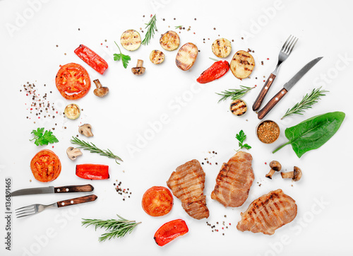 Frame of different food grilled on a white background