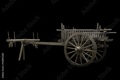Foto wooden cart isolated on black background