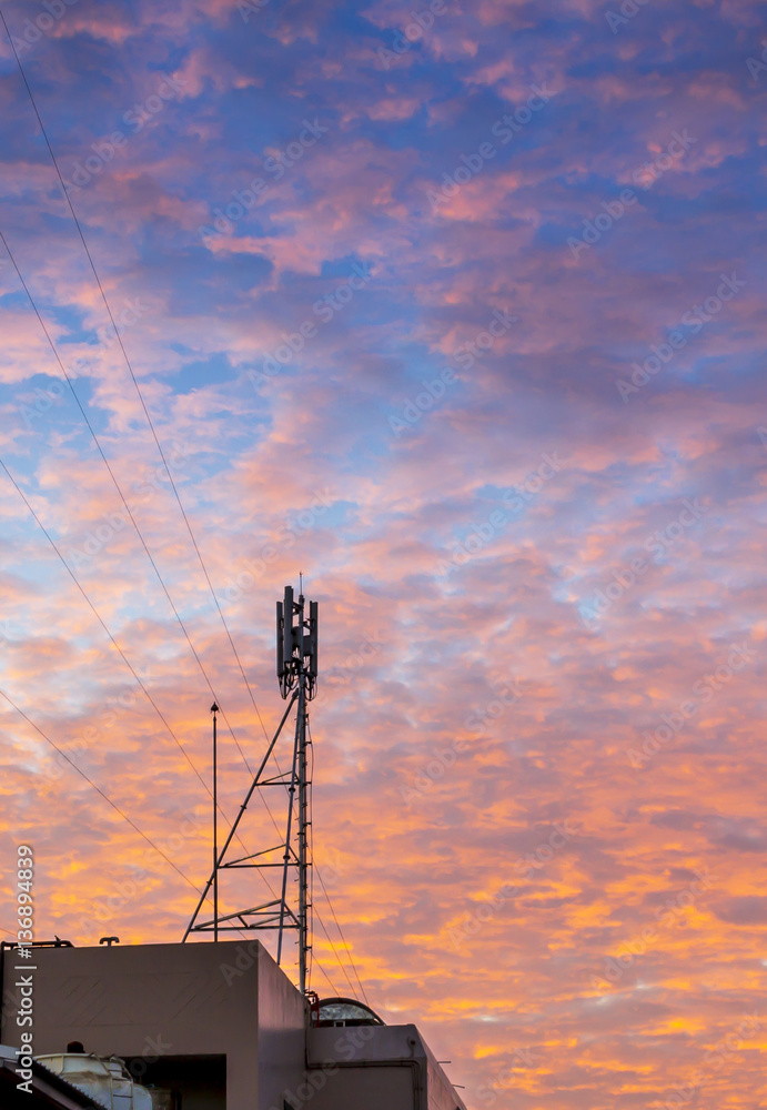 Telecom tower with  golden cloud