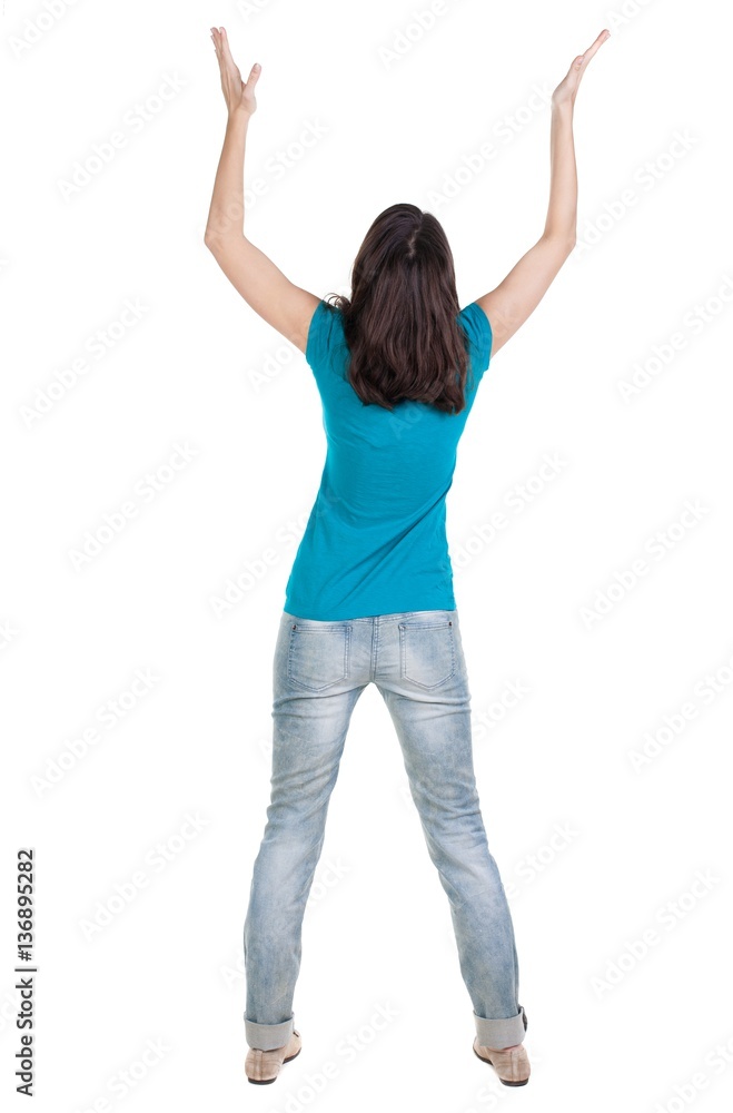 Back view of joyful woman celebrating victory hands up Back view of joyful woman celebrating victory hands up