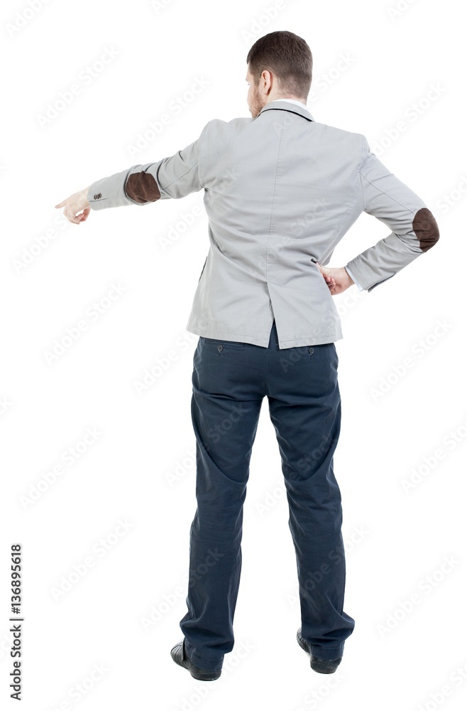 Back view of pointing business man. gesticulating young guy in black suit. Rear view people collection. backside view of person. Isolated over white background. office worker in a shirt and trouse Back view of pointing business man. gesticulating young guy in black suit. Rear view people collection. backside view of person. Isolated over white background. office worker in a shirt and trouse