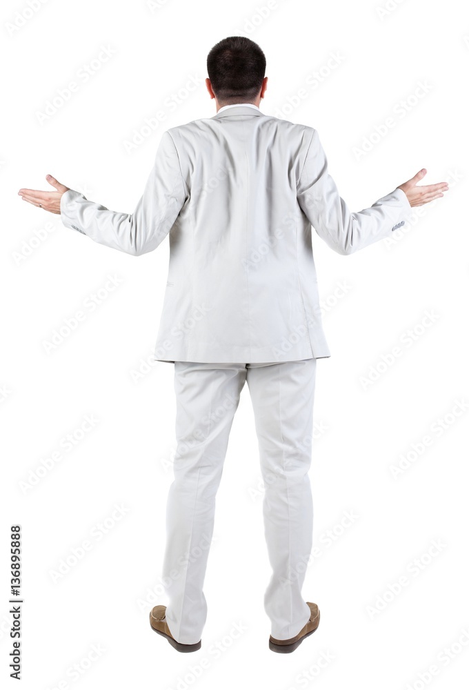 Back view of shocked and scared young business man. Back view of shocked and scared young business man.