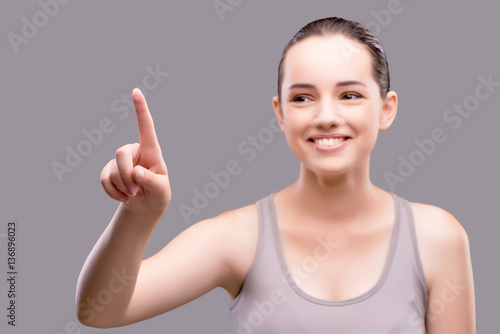 Wallpaper Mural Young sports girl pressing virtual button  Torontodigital.ca