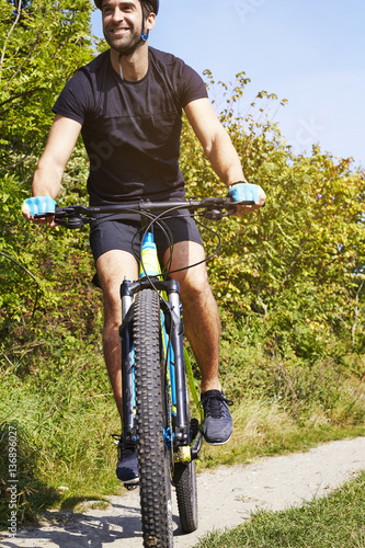 Cycling man in countryside © sanneberg