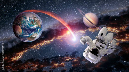 Fototapeta Naklejka Na Ścianę i Meble -  Astronaut planet Earth Saturn spaceman launch outer space galaxy universe. Elements of this image furnished by NASA.
