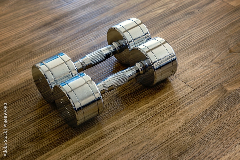 A Pair of Dumbells in a Sport Fitness Room A Pair of Dumbells in a Sport Fitness Room