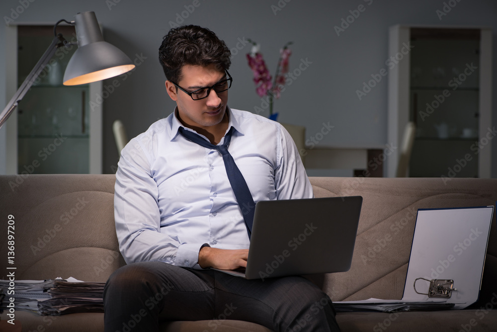 Businessman workaholic working late at home Businessman workaholic working late at home