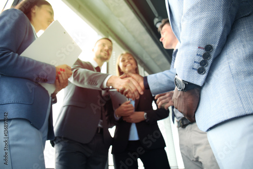 Business people shaking hands, finishing up a meeting