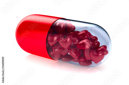 capsule with heart on white...