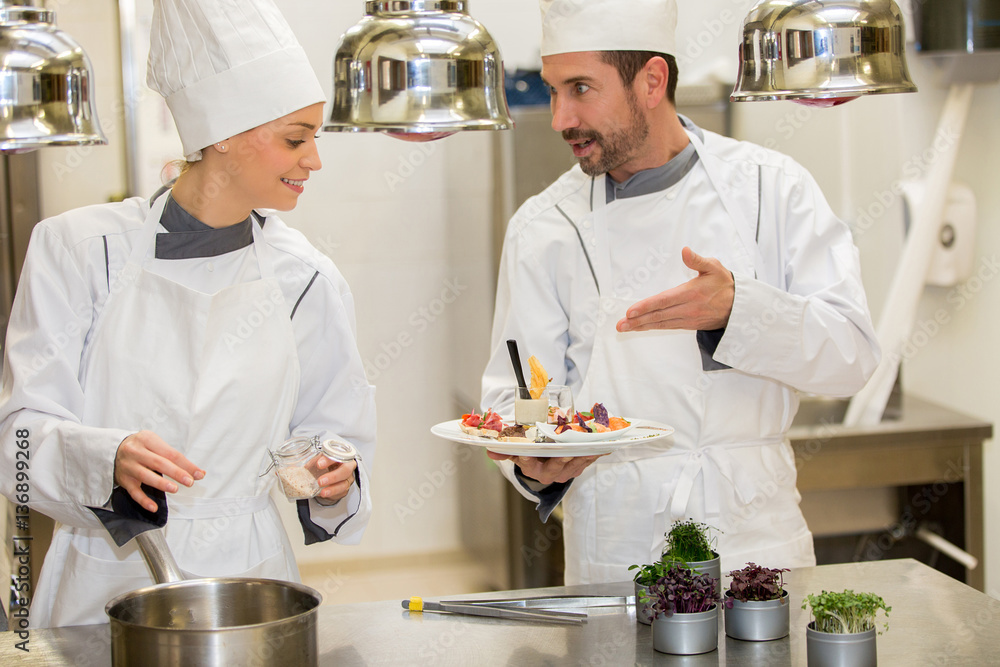 chefs cooking in kitchen