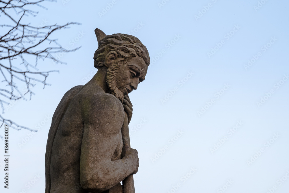 Neptune figure, allegorical sculpture from sandstone from the 18th century on the puppenbruecke in Luebeck Germany