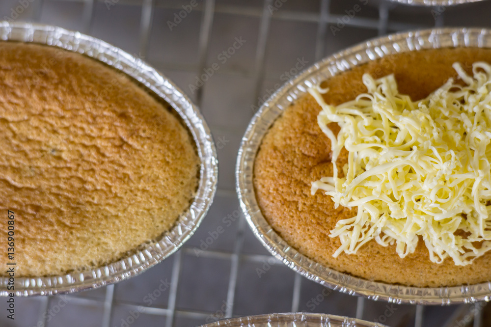 cake, making cakes, Close up cakes with cheddar cheese on top. cake on wooden background. cake, making cakes, Close up cakes with cheddar cheese on top. cake on wooden background.