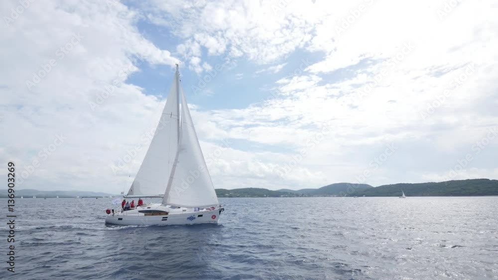 Sailing ship yachts with white sails in the open Sea. Luxury boats. Sailing ship yachts with white sails in the open Sea. Luxury boats.