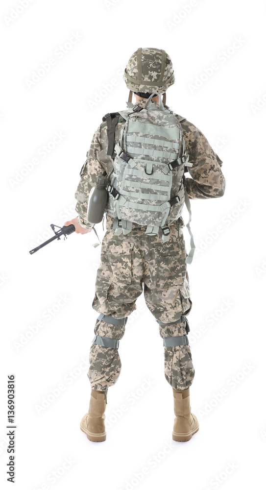 Soldier in camouflage holding rifle, isolated on white Soldier in camouflage holding rifle, isolated on white