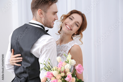 Cute happy wedding couple a...