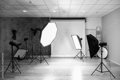 Empty photo studio with lighting equipment