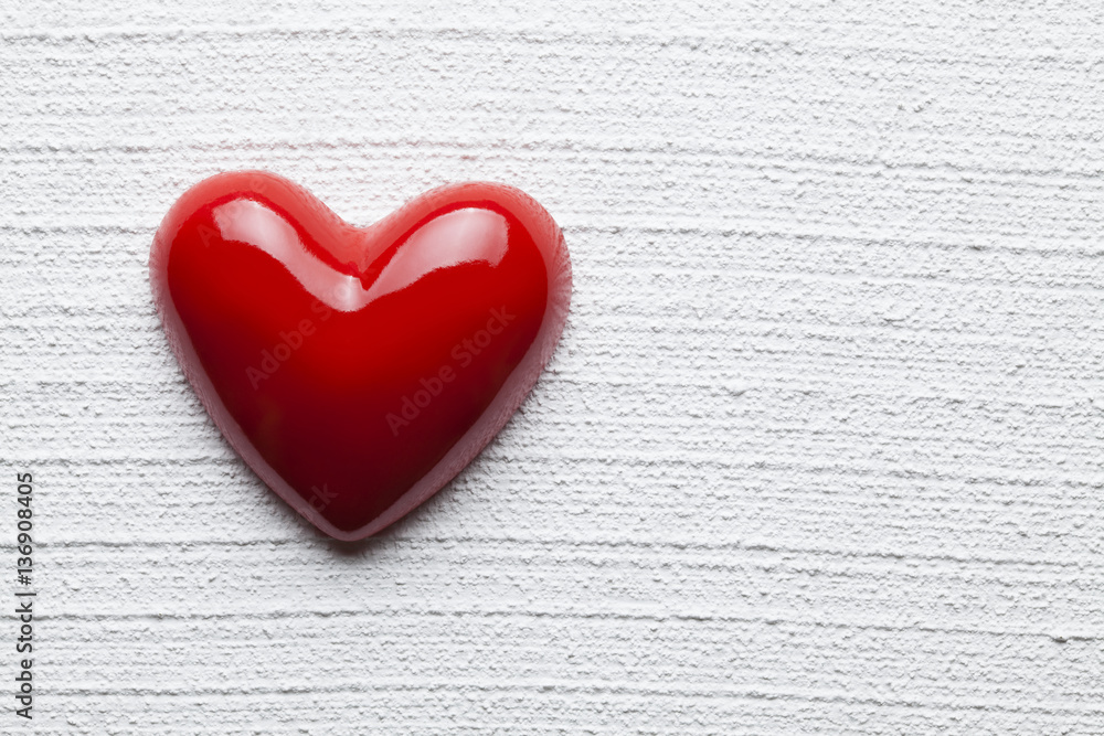Red heart on white plastered background Red heart on white plastered background