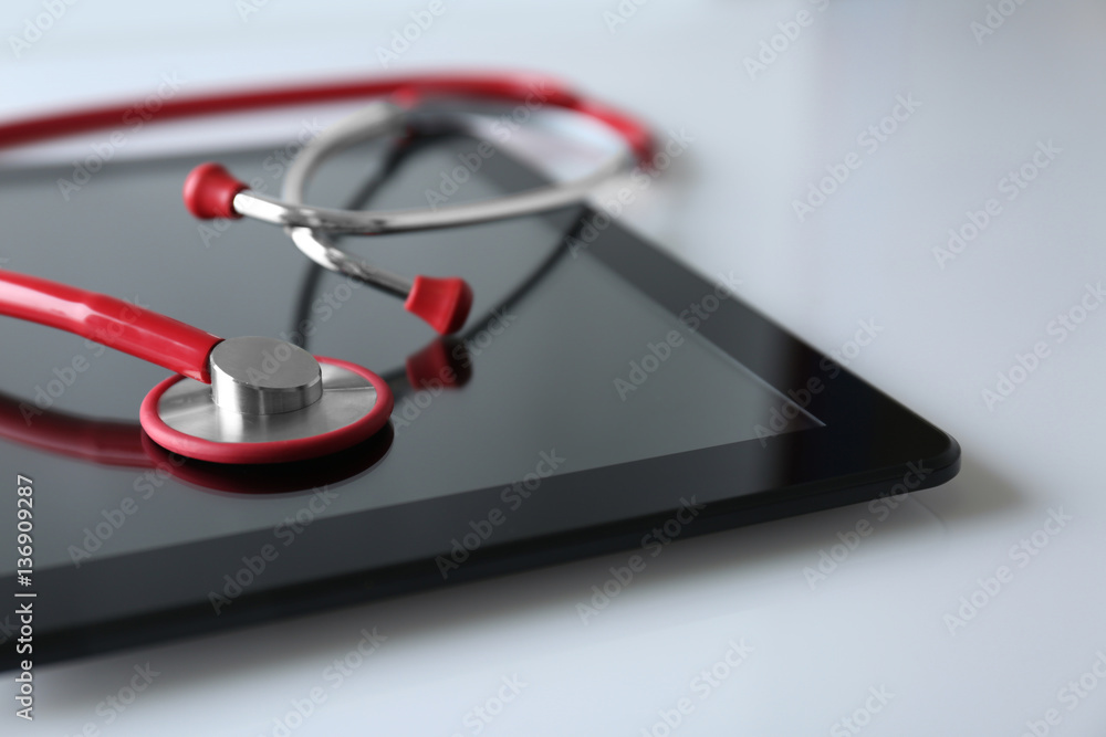Stethoscope and tablet pc on white background Stethoscope and tablet pc on white background