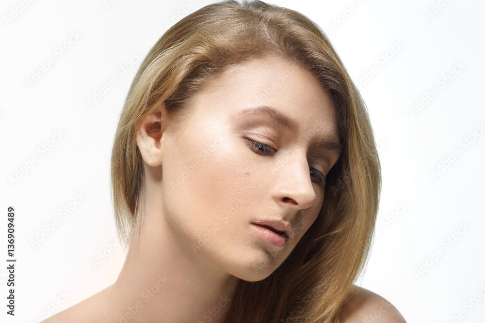 Fototapeta premium Studio shot of young beautiful woman with nude makeup