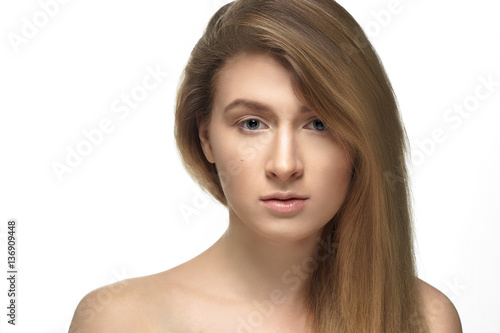 Studio shot of young beautiful woman with nude makeup