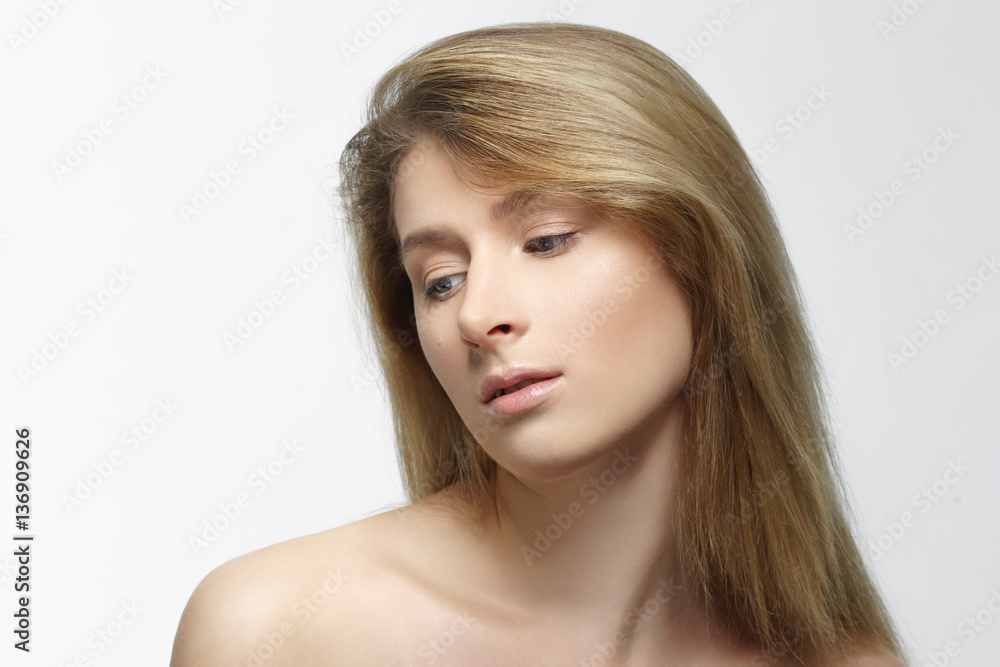 Fototapeta premium Studio shot of young beautiful woman with nude makeup