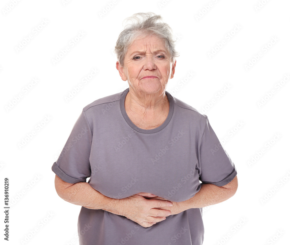Elderly woman suffering from stomach ache on white background Elderly woman suffering from stomach ache on white background