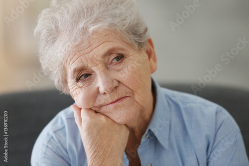 Depressed elderly woman at ...