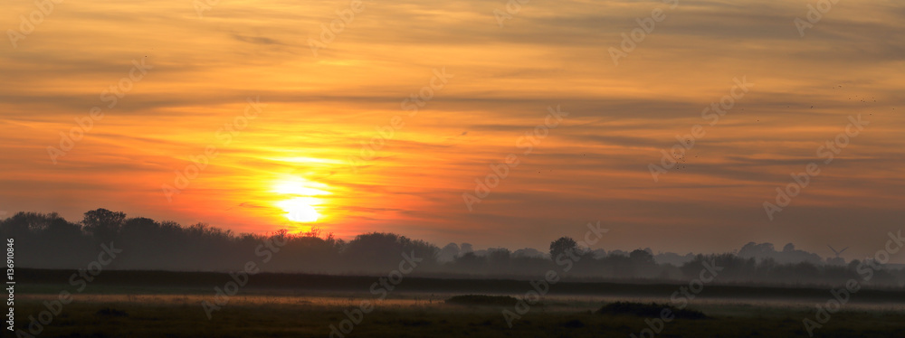 Sunset over farmland, Gloucestershire, England, UK.