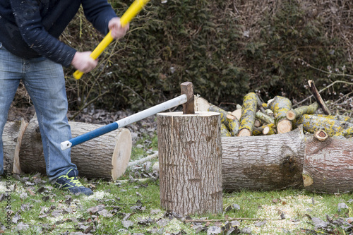 Man break wood with hammer photo