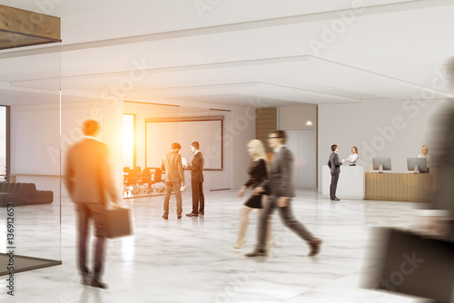 Business people rushing through an office hall