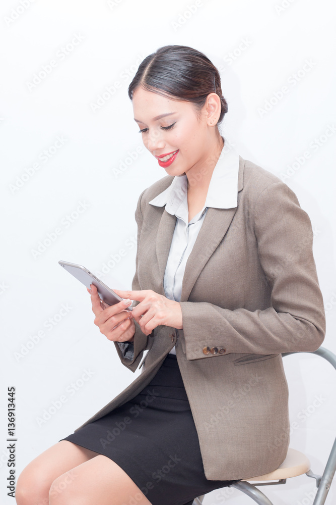 Businesswoman use of mobile phone. young woman used smart phone and tablet. Businesswoman use of mobile phone. young woman used smart phone and tablet.