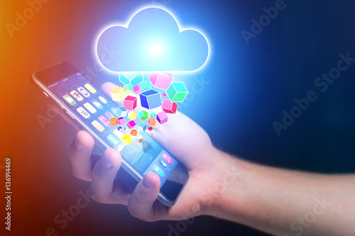 Concept of cloud storage icon flying out a smartphone - technolo