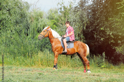 young in shape man on a horse