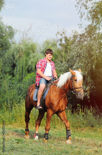 young in shape man on a horse © lanarusfoto