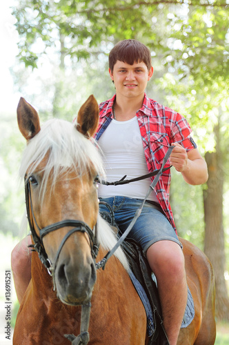 young in shape man on a horse